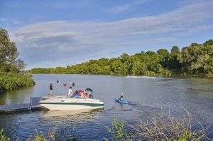 People enjoying a day boating and paddling on the Heritage Grand River.